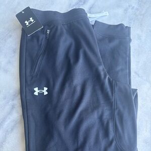 Black under Armour, sweatpants with capped ankles, and zipper pockets